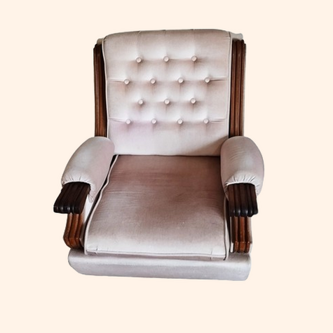 Vintage armchair with tufted upholstery and wooden armrests.