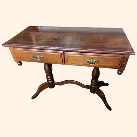 Brown wooden desk with two drawers and curved legs.