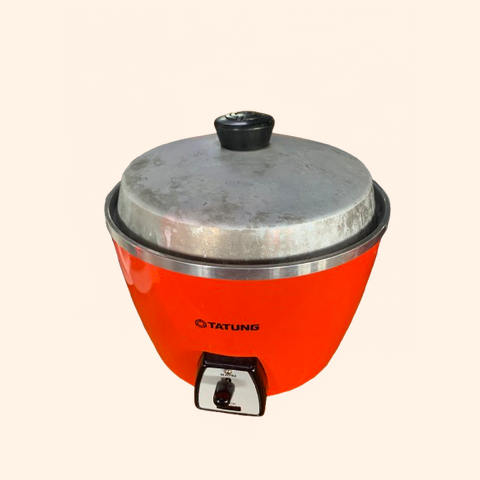 Bright orange rice cooker with a silver lid.