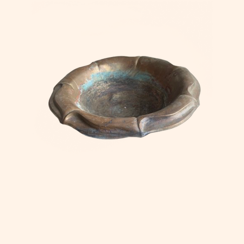 Bronze decorative bowl with fluted edges.