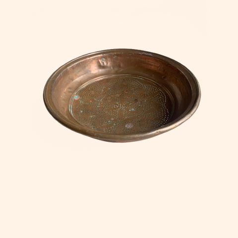 Bronze serving platter with a slightly worn surface.