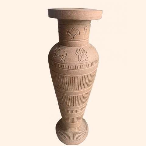 Handmade vase with decorative carvings and patterns.