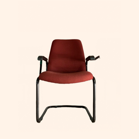 Red upholstered office chair with armrests.