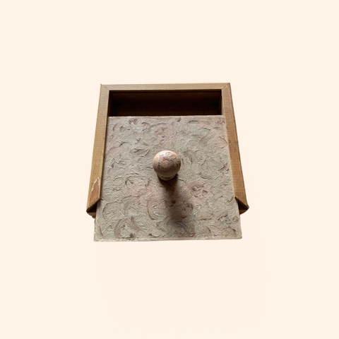 Small Wooden drawer box with a round knob and a patterned front.