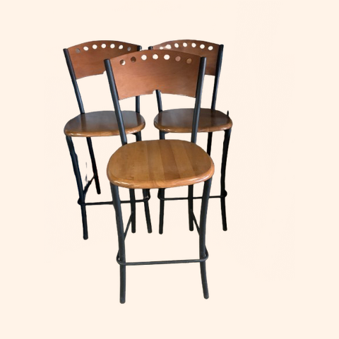 Three wooden and metal bar stools.