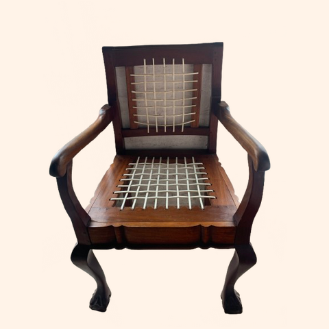 Wooden armchair with woven seat and backrest.