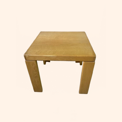 Wooden square table with four legs.