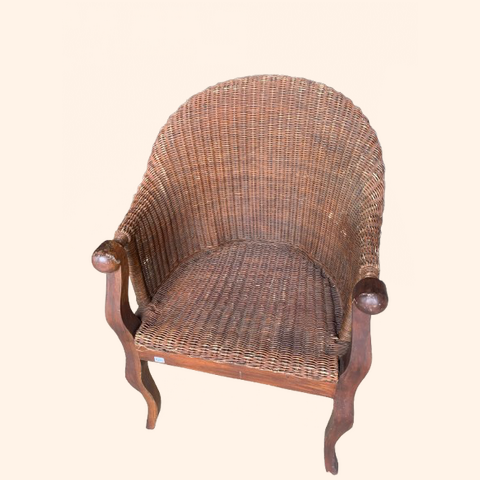 Woven wicker chair with wooden armrests and legs.