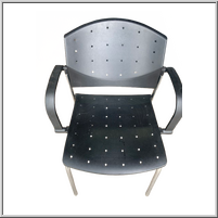 Black perforated chair with armrests.