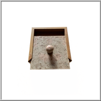 Small Wooden drawer box with a round knob and a patterned front.