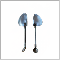 Two metal shoehorns with curved handles.